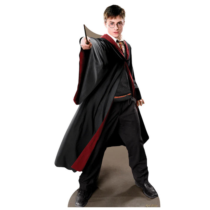 Lifelike cardboard cutout of Harry Potter from the Harry Potter series, standing 1.70m tall, in his wizard robes with a wand, positioned upright for use as a decoration.